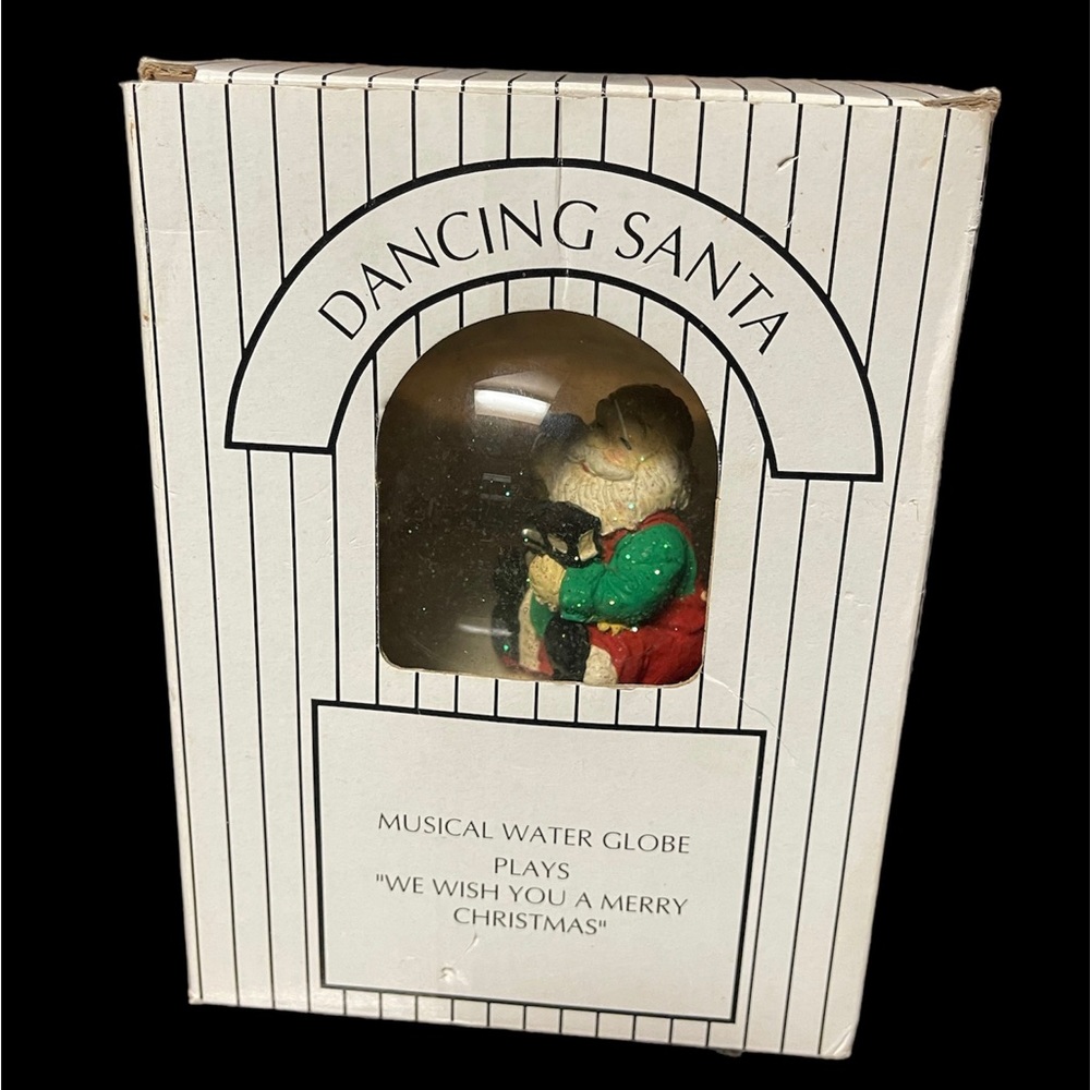 Dancing Santa Musical Water Snow Globe 
Plays “We Wish You A Merry Christmas”